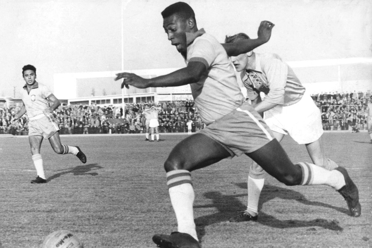 Brazilian soccer star Pele runs with the ball in Malmoe, Sweden, on May 8, 1960. Pele became famous when he played with the Brazilian national team at the 1958 FIFA World Cup in Sweden.  (Tribune News Service)
