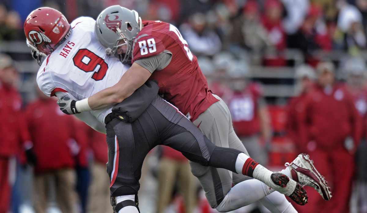 Defensive end Travis Long, nailing Utah QB Josh Hayes last season, says summer workouts have the Cougars in better shape this season. (File)