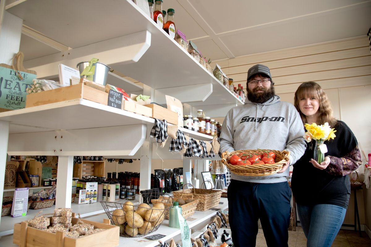 Owners Zack Thurman and Taryn Graves stand inside Garland Mercantile, their small food and gift store at 823 W. Garland Avenue.  (Jesse Tinsley/THE SPOKESMAN-REVI)