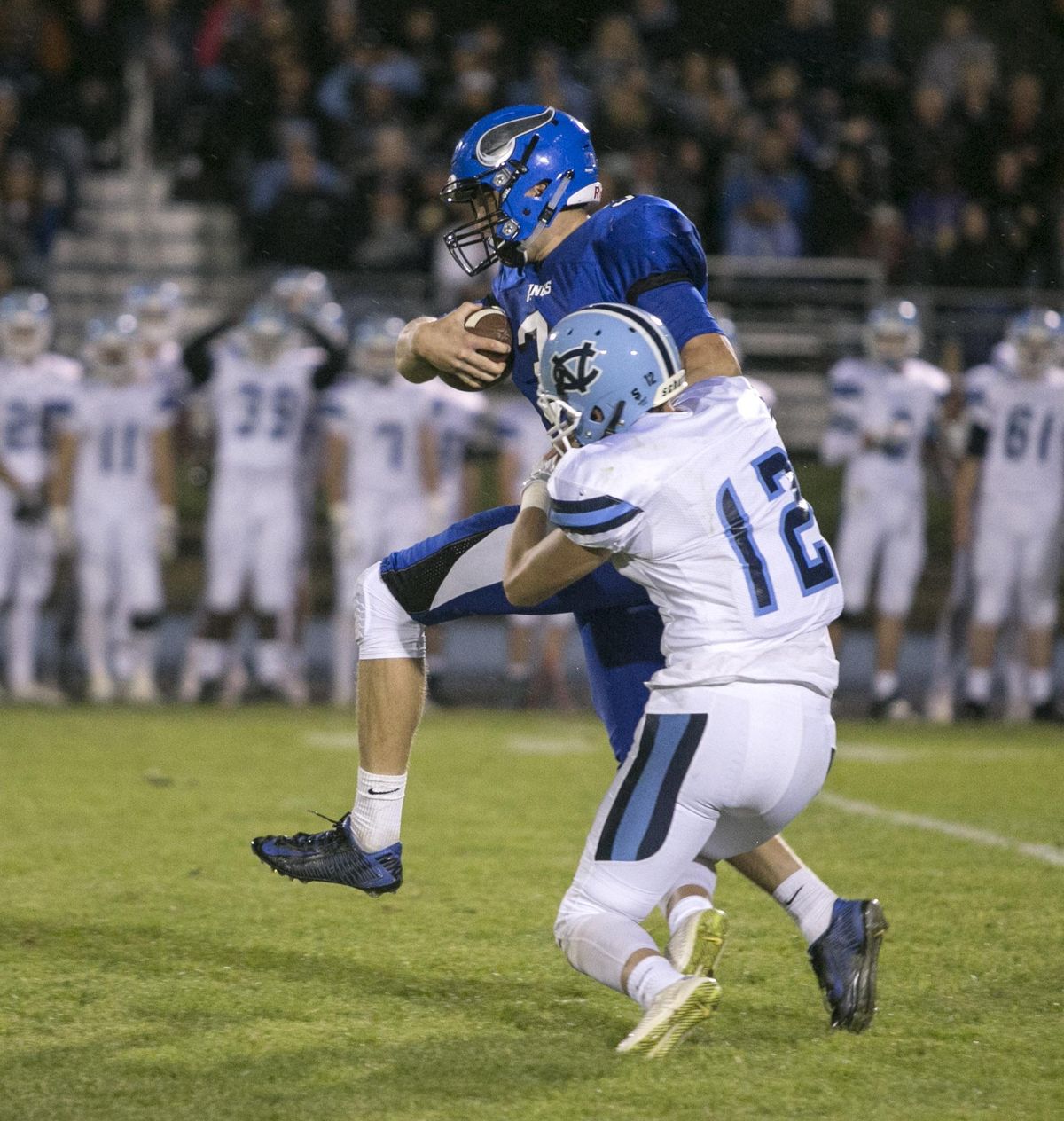 Coeur d'Alene's Cole Yankoff breaks free of a takle by Central Valley's Christian Williams to score late in the second quarter against Central Valley Friday night at Coeur d'Alene High School. (BRUCE TWITCHELL)