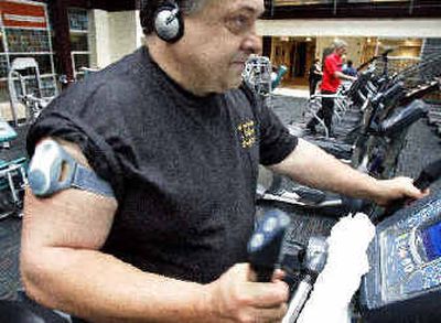 
Robert Dojonovic, of Monessen, Pa., works out at the Center for Fitness and Health in Rostraver, Pa. Dojonovic wears the calorie counting Bodybugg by Body Media.
 (Associated Press / The Spokesman-Review)