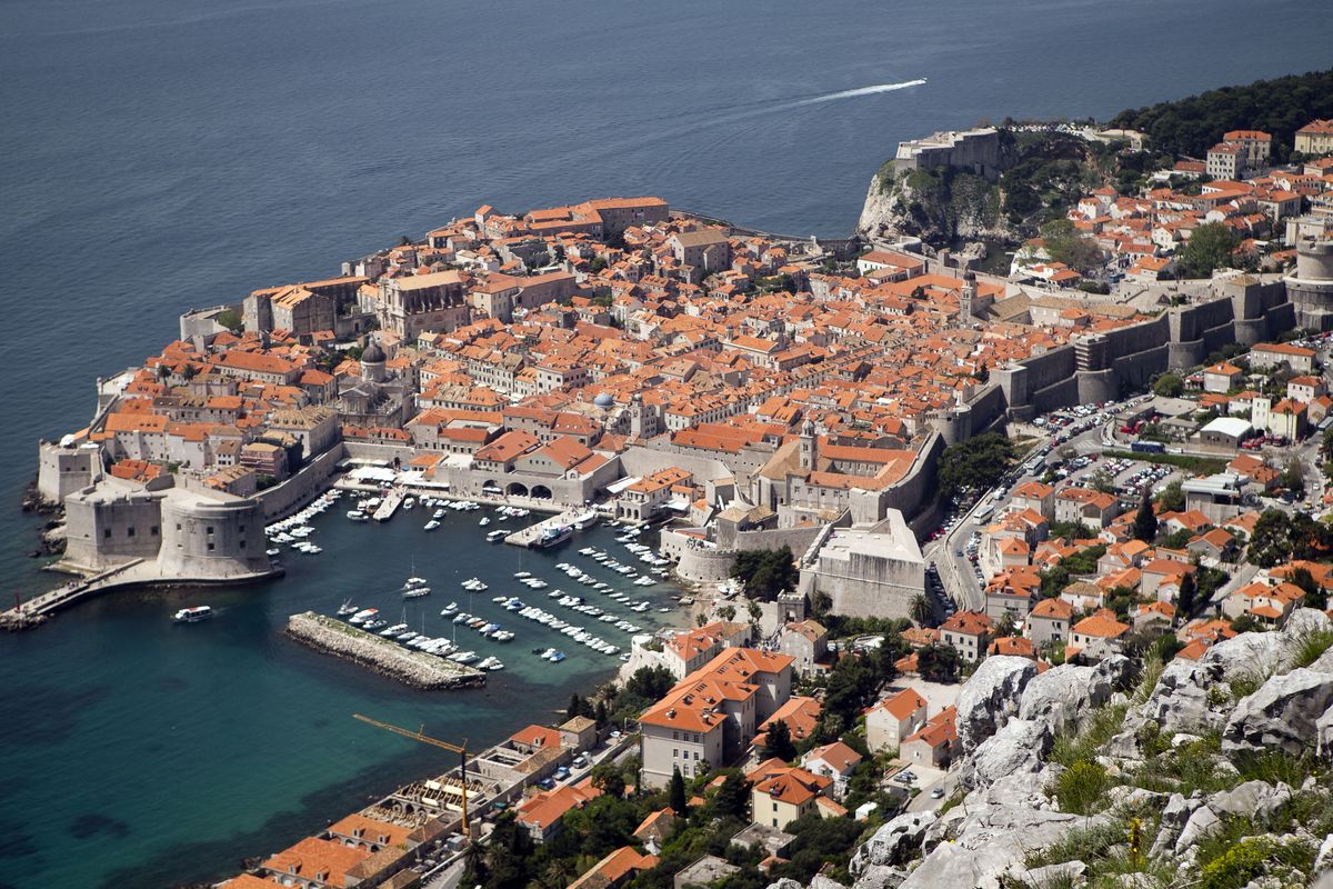 WITH STORY CROATIA GOLF REFERENDUM - Dubrovnik old town is pictured from Srdj, the hill above the city, Friday, April 26, 2013. The residents of this scenic Croatian Adriatic sea resort will decide hold a referendum on Sunday April 28, 2013, whether to allow the 1.1-billion euros ($1.4 billion) golf park development project on the hill above the city that many claim endangers their ancient city, often dubbed the Pearl of the Adriatic, and the outcome could have serious consequences on the future of foreign investments in Croatia. (Darko Bandic / Associated Press)