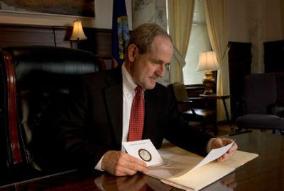 
Idaho Governor Jim Risch works at his desk Friday afternoon. Risch will be turning over the governorship to C. L. 