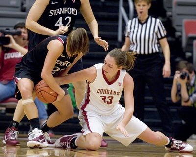 Stanford’s Jeanette Pohlen, left, and WSU’s Carly Noyes battle for the ball on Sunday in Pullman. (Associated Press)