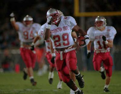 
Associated Press Mark Fields' school-record 71-yard fumble return was the lone touchdown when Washington State surprised Illinois on Sept. 1, 1994.
 (File Associated Press / The Spokesman-Review)