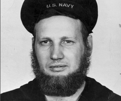 In this June 20, 1942 photo provided by the Naval History and Heritage Command, Howard Curtis, a U.S. Navy second-class aerographer, wears a seven-month’s beard at Dutch Harbor, Alaska. Though the Navy said in July 2018, that its servicewomen could wear longer hairstyles, servicemen have not been permitted to wear beards, which were banned in 1984. (AP)