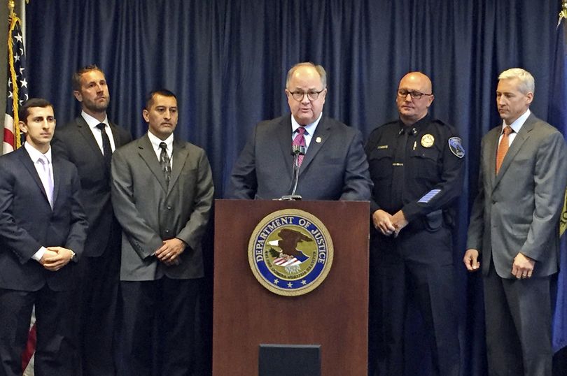 U.S. Attorney for Idaho Bart Davis, center at podium, speaks during a press conference in Boise, Idaho, on Thursday, Oct. 12, 2017. Davis said he believes a new offshoot of the street and prison gang Surenos is close to being eradicated after a series of indictments in state and federal court. Also pictured from left to right are: Special Assistant U.S. Attorney Francis Zabari, Alcohol Tobacco and Firearms agent Ken Cooper, Idaho Department of Correction Director Henry Atencio, Davis, Caldwell Police Chief Frank Wyant and FBI supervisor senior resident agent Doug Hart. (AP / Rebecca Boone)