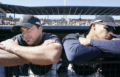 
M's catcher Jamie Burke, left, is in line to back up Kenji Johjima, right, when the season opens. 
 (Associated Press / The Spokesman-Review)