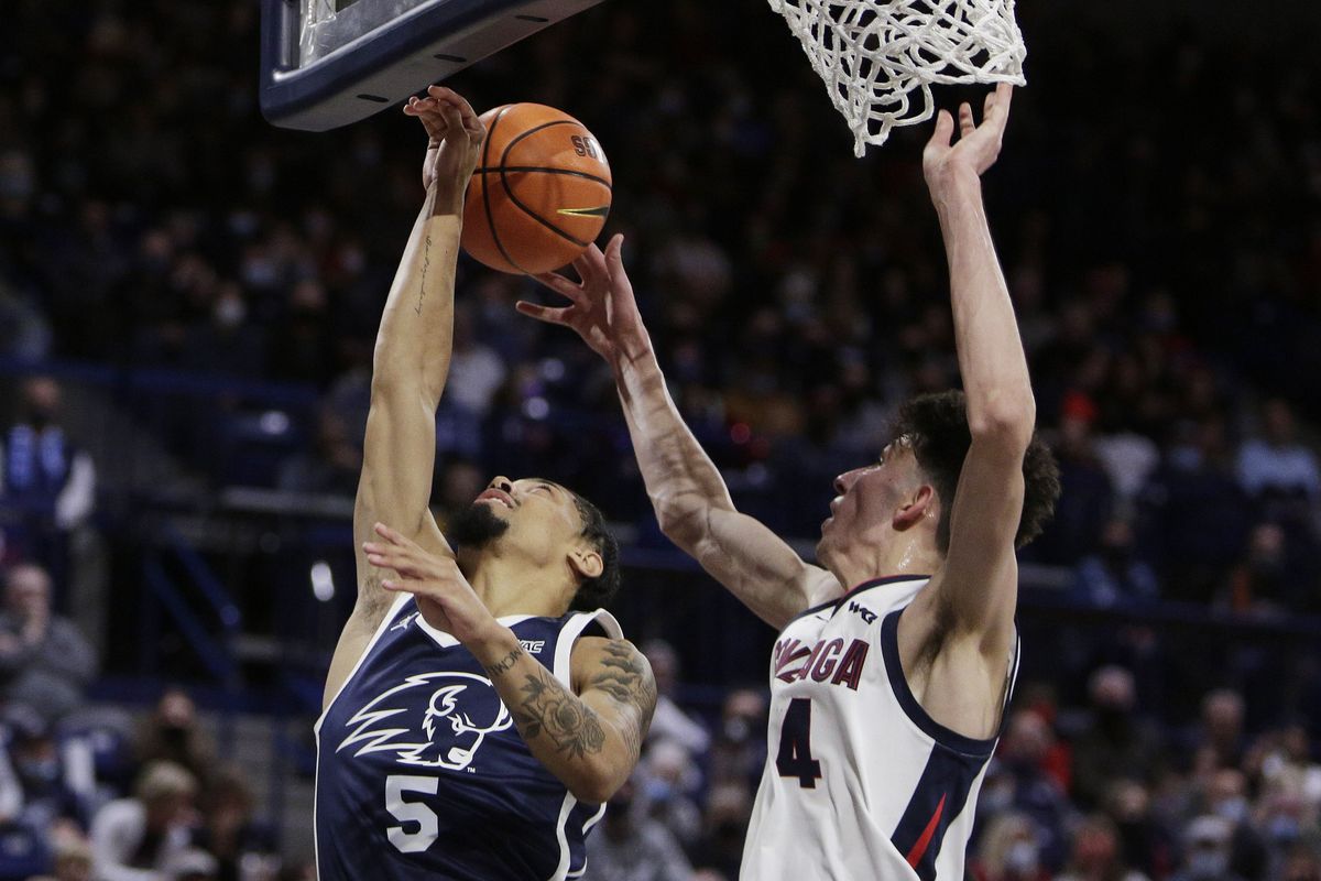Gonzaga’s Chet Holmgren blocks a shot by Dixie State guard Jamaal Barnes during in the first half of Tuesday’s game.  (Tyler Tjomsland / The Spokesman-Review)