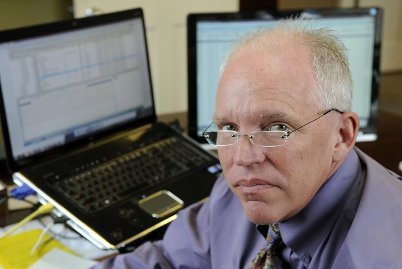 Marcus Lawton, of Global CompuSearch, heads a computer forensics squad that digs into hard drives looking for how intruders access bank login credentials. (Dan Pelle)