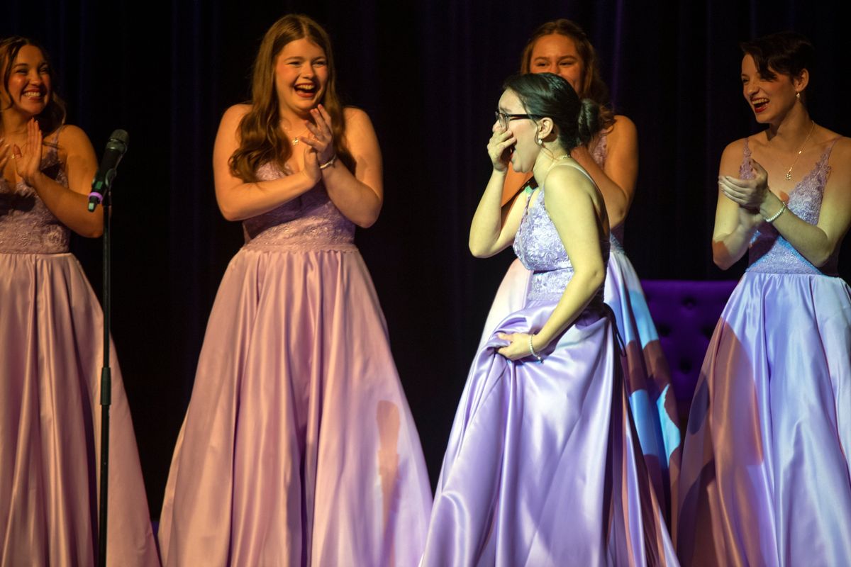 Newly-chosen Lilac Festival Queen Josephine Ortega of Medical Lake High School walks to center stage to accept her crown at the Bing Crosby Theater in Spokane Saturday, Mar. 25, 2023 at the annual coronation event of the Lilac Festival. With the seven member of the royal court already chosen, Ortega was chosen as queen and the other six designated as princesses.  (Jesse Tinsley/The Spokesman-Review)