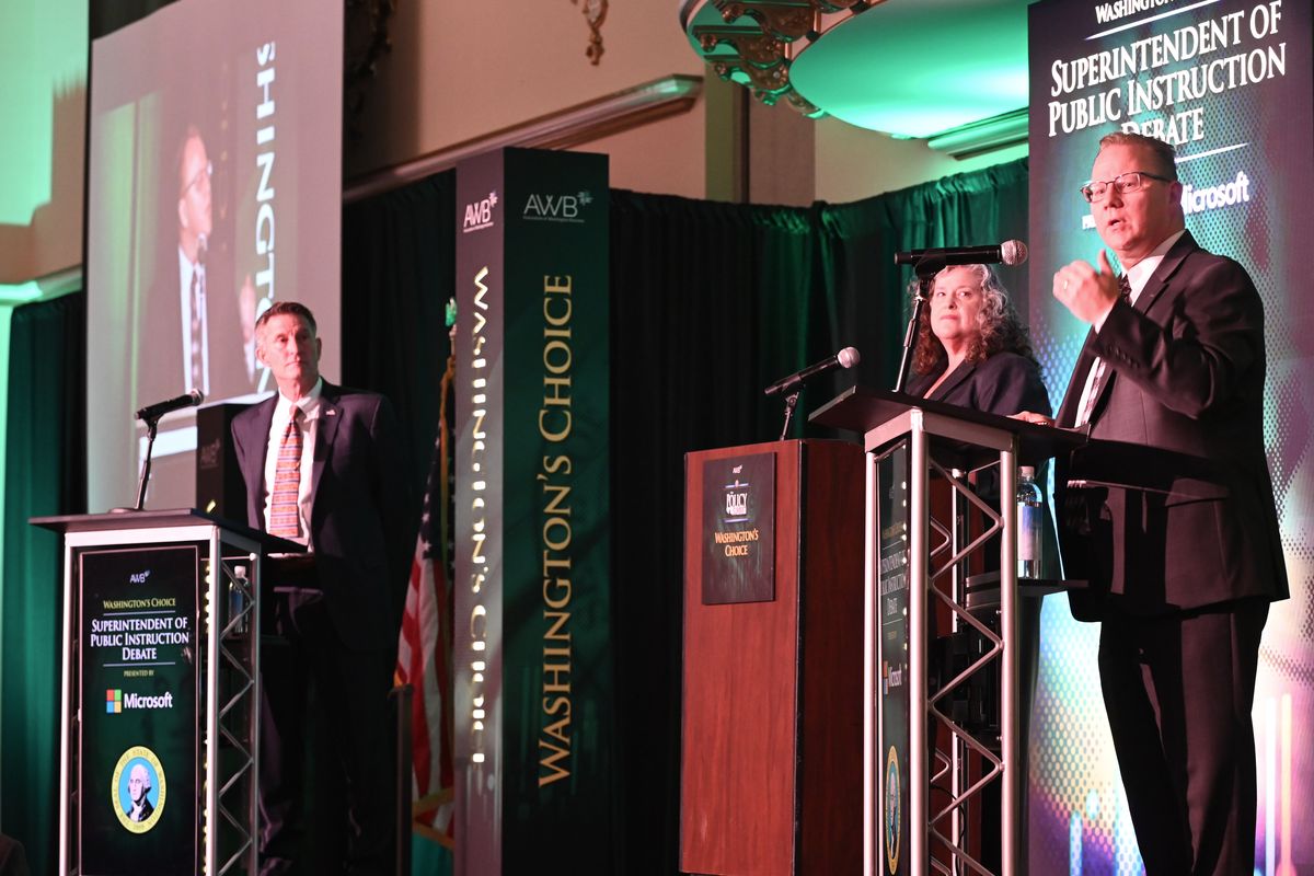 Chris Reykdal, the Washington state Superintendent of Public Instruction, debates opponent David Olson, left, in front of the meeting of the Association of Washington Business at the Davenport Hotel in Spokane on Wednesday, Sept. 18, 2024.  (Jesse Tinsley/The Spokesman-Review)