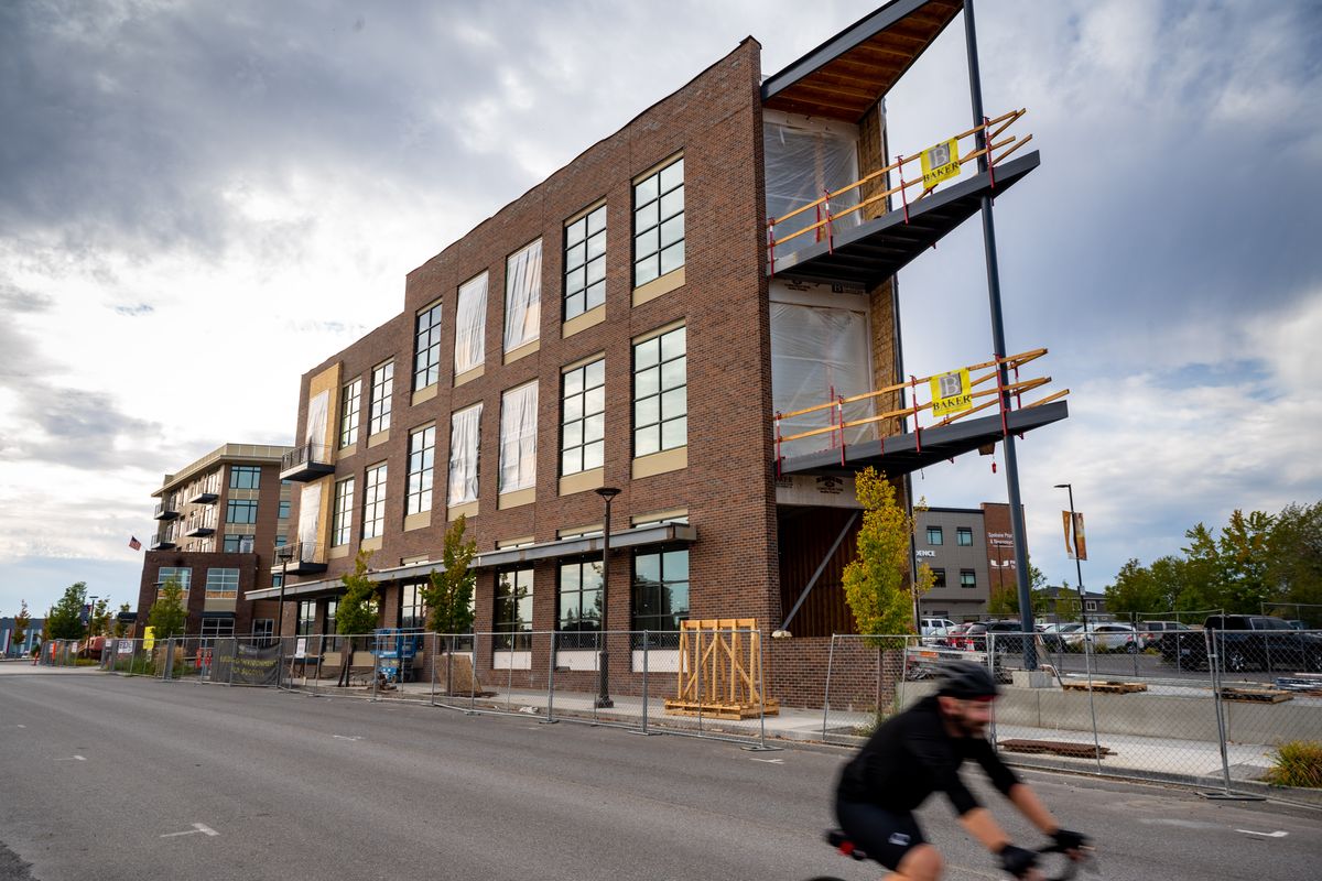 Two mixed-use buildings – the FlatIron building (front) and the West of Jefferson building – are shown Monday under construction in the Kendall Yards Business District.  (COLIN MULVANY/THE SPOKESMAN-REVI)