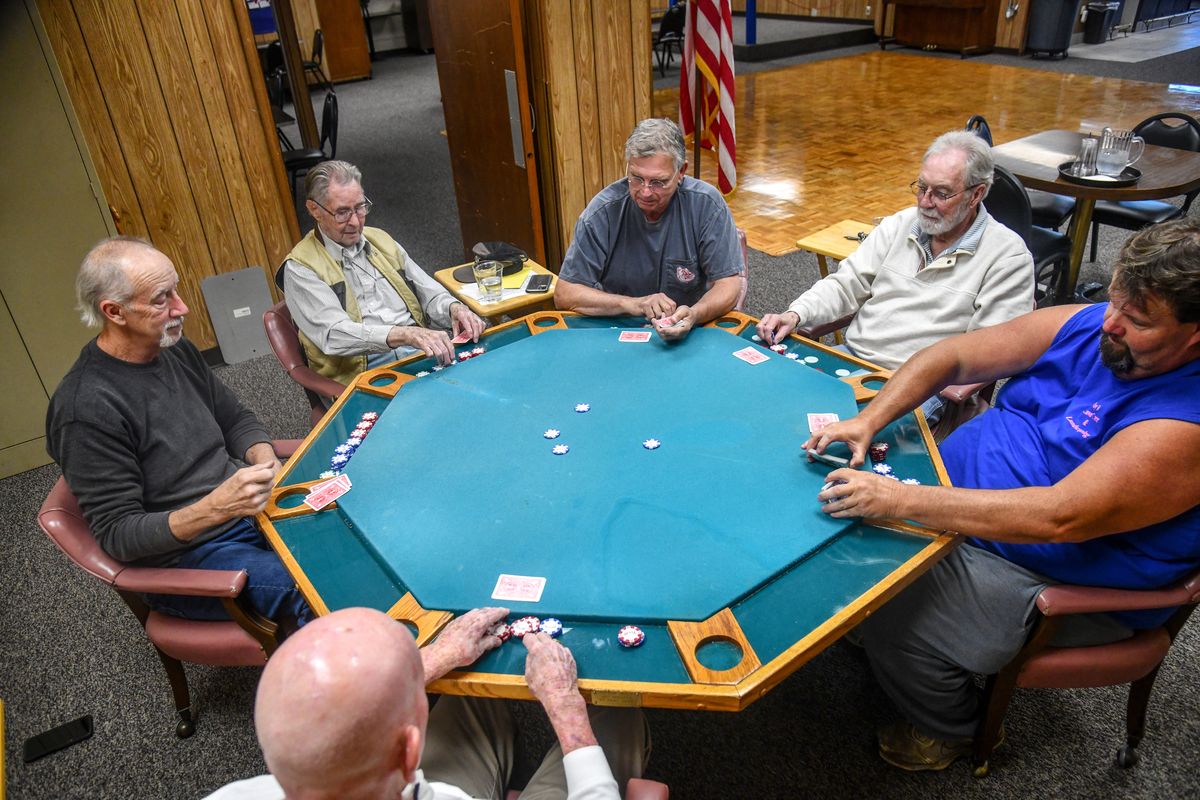 Playing cards at the VFW Post 51 in Spokane, friends, from bottom left, Pat Kenney, Mike Farrell, Bob Fasbender, in the vest, Bob Palladino, Jim Christie and Ray DeLong, gather on Fasbender’s 100 birthday.  (DAN PELLE/THE SPOKESMAN-REVIEW)