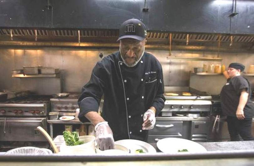 Executive Chef Gene Tillman preps sandwich dishes for lunch at the Coeur d'Alene Inn on Wednesday. Tillman has worked at Mulligan's for the past 31 years and will soon be retiring. More here. (Loren Benoit/Coeur d'Alene Press)