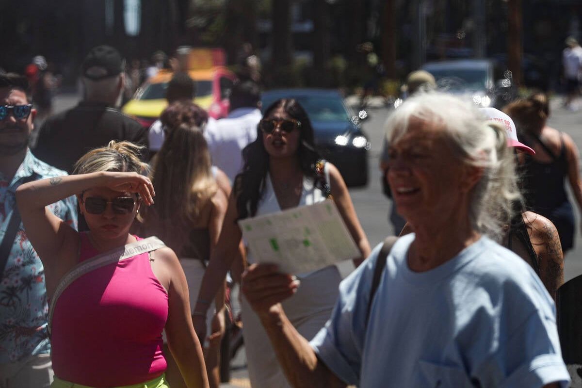 Tourists walk the Strip on July 7 in Las Vegas. (Rachel Aston/Las Vegas Review-Journal/TNS)