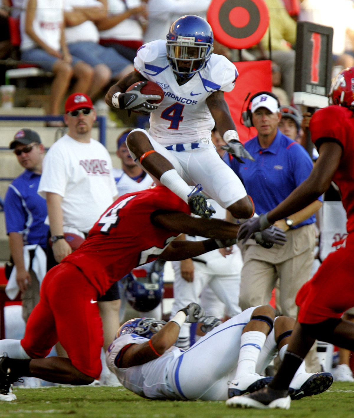 Boise State’s Titus Young jumps over Fresno State’s Desia Dunn in the first half.  (Associated Press / The Spokesman-Review)