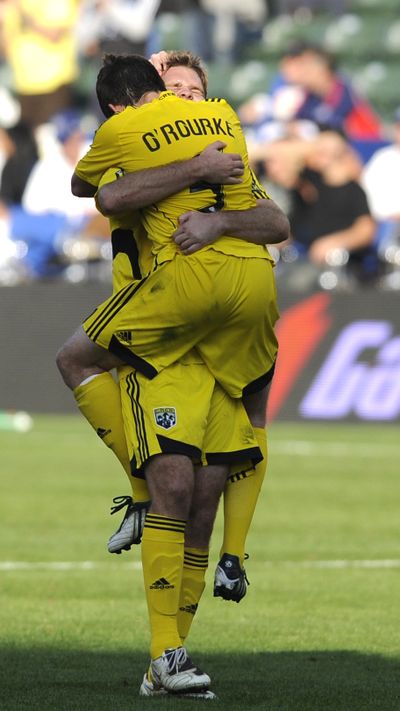 Chad Marshall and Danny O’Rourke of the Crew celebrate their victory.   (Associated Press / The Spokesman-Review)