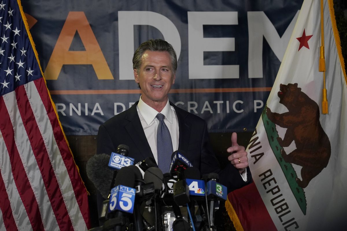 California Gov. Gavin Newsom addresses reporters, after beating back the recall attempt that aimed to remove him from office, at the John L. Burton California Democratic Party headquarters in Sacramento, Calif., Tuesday, Sept. 14, 2021.  (Rich Pedroncelli)