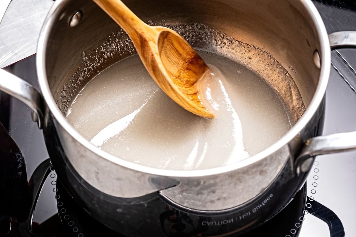 Avoid getting the sugar-water mixture on the sides of the pan as it may lead to crystallization and a grainy caramel.  (Scott Suchman/For The Washington Post)