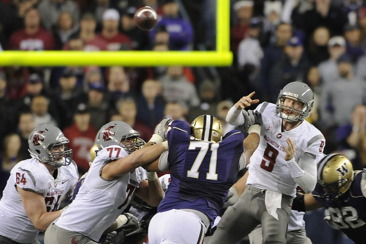 WSU’s offensive line is unable to stop UW’s Danny Shelton (71) as he hits the arm of quarterback Marshall Lobbestael and deflects a pass. (Christopher Anderson)