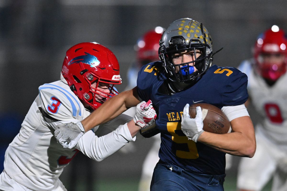 Mead Panthers Keegan Mallon (5) carries the ball against Eastmont Wildcats Evan Mathena (3) in the first half on Fri. Nov. 8, 2024 at Union Stadium in Spokane WA.  (James Snook)