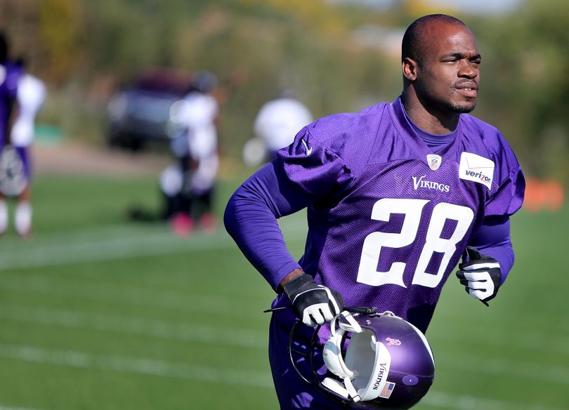 Minnesota Vikings' Adrian Peterson makes his way off an NFL football practice field at Winter Park in Eden Prairie, Minn., Friday, Oct. 11, 2013. Peterson said he is certain he will play Sunday despite a serious personal matter that caused him to miss practice earlier this week. (Elizabeth Flores / The Star Tribune)