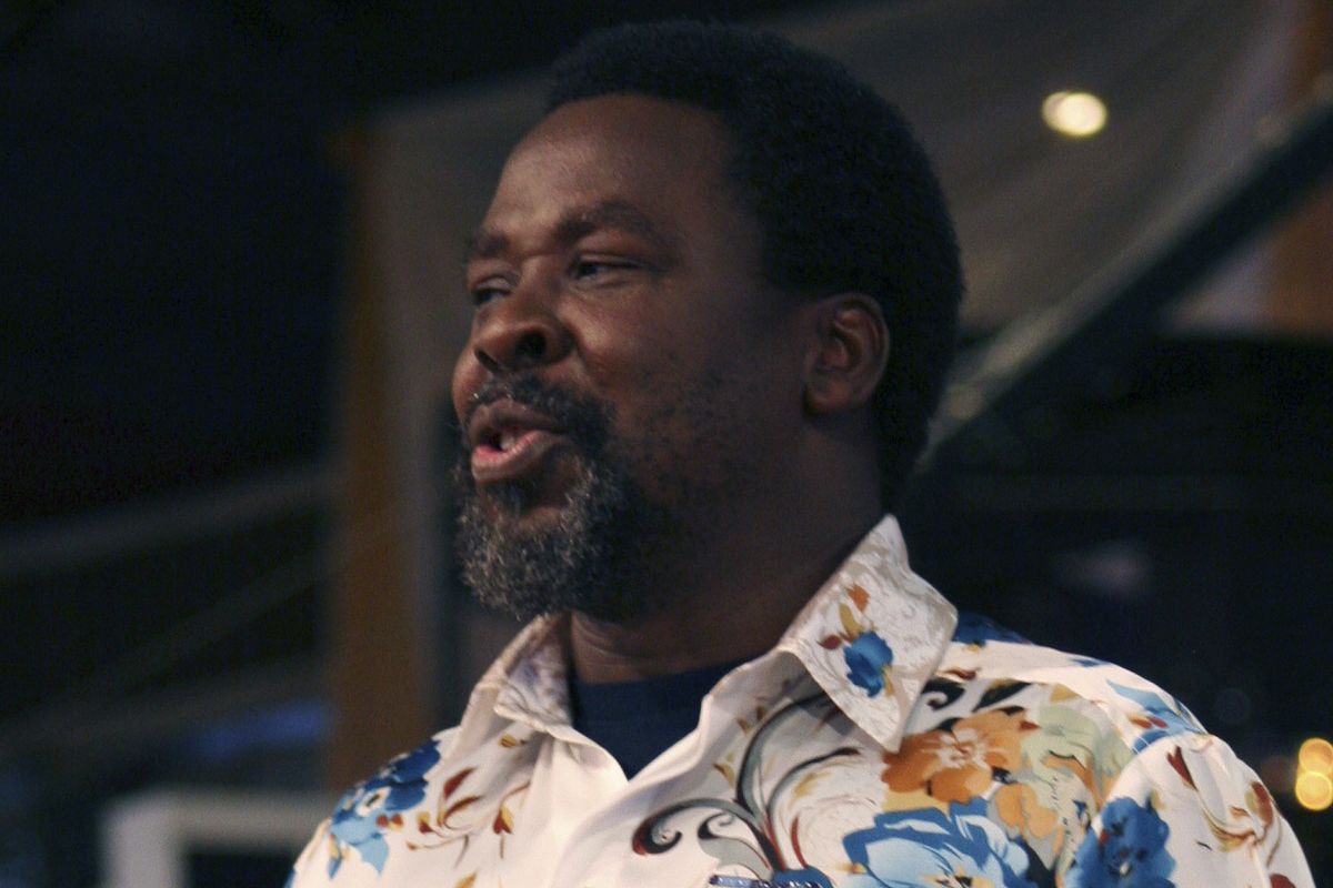 In this Sept. 15, 2013 photo, T.B. Joshua conducts a service at the Synagogue, Church of All Nations, in Lagos Nigeria. One of Africa’s most popular televangelists, T.B. Joshua, has died, according to his church. He was 57. The Nigerian-born pastor was founder of the mega church, Synagogue Church Of All Nations (SCOAN) which also runs the Emmanuel Television Station in Lagos, Nigeria. The church announced his death in a statement Sunday, June 6, 2021. Joshua was noted for making predictions and for his claims to cure various ailments and to make people prosper through miracles.  (Carley Petesch)