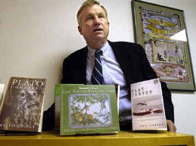 
Ivar Nelson is the interim publisher of EWU Press and is shown with several of his favorite publications. 
 (Christopher Anderson/ / The Spokesman-Review)