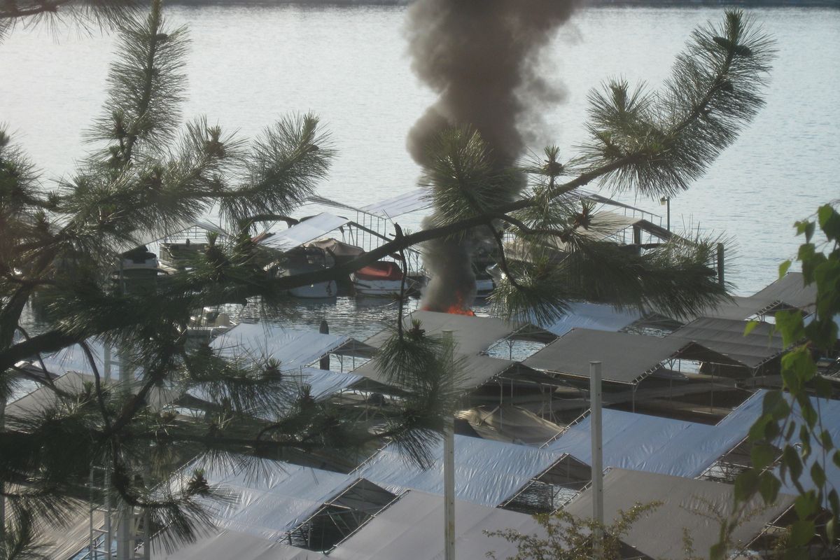 A boat is shown on fire at Hayden Lake Marina in Hayden Lake, Idaho, on June 23, 2010. (Rock Lamb)