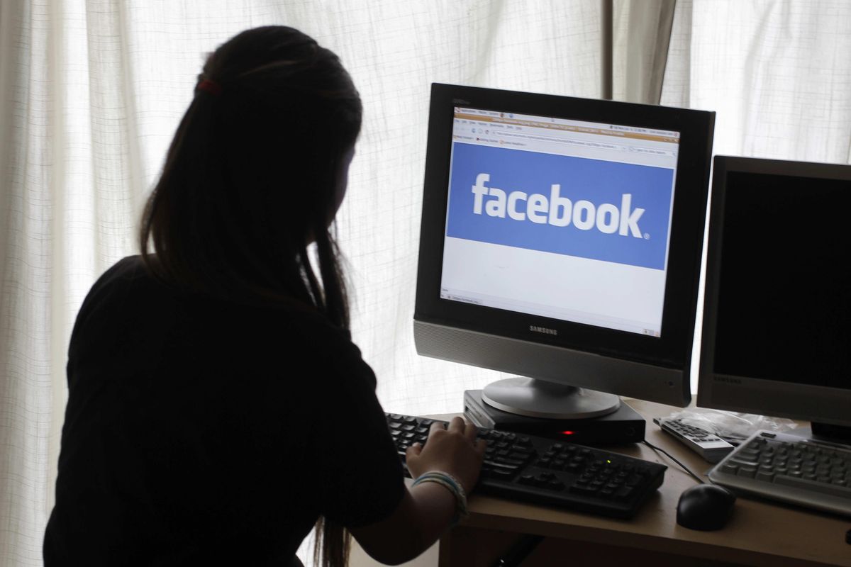 A Pew Research Center survey found that 97 percent of teens age 13-17 use social media. (Paul Sakuma / AP)