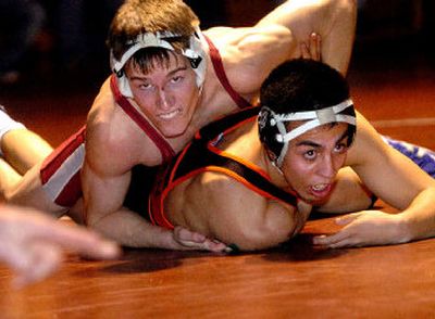 
Jeff Hedges, top, working toward a win last season over Lassen's Johnny Rojas, has returned to the Cardinals' wrestling team after placing fifth in the nation. 
 (File/ / The Spokesman-Review)