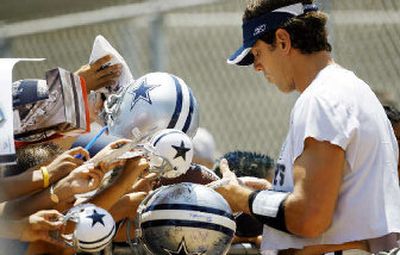 
Dallas quarterback Drew Bledsoe is having an easier time hooking up with fans than with new receiver Terrell Owens. 
 (Associated Press / The Spokesman-Review)