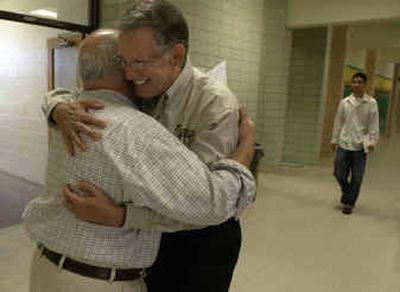 
Art Dolan, right, hugs Shadle Park High School teacher Hank Mendoza recently during a visit to the school. Dolan is retiring after many years with the Spokane Public Schools. He was a longtime teacher at Shadle before becoming a mentor teacher two years ago.
 (Colin Mulvany / The Spokesman-Review)