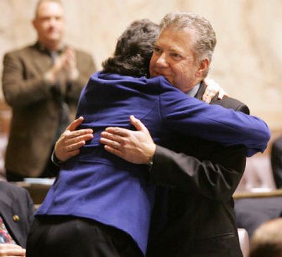 
Rep. Ed Murray, D-Seattle, right, and Rep. Eileen Cody, D-Seattle, celebrate the vote to extend rights protection to gays and lesbians.
 (Associated Press / The Spokesman-Review)