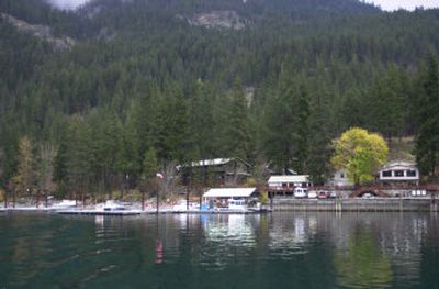 
This Nov. 9, 2005, photo shows the forest behind the boat landing and a lodge operated by the National Park Service in Stehekin. Residents of this remote hamlet, reachable only by boat, float plane or overland trail, have long resisted pleas to create their own fire district. Much of that forest has been burned in the Flick Creek fire, which  was sparked by a campfire July 26. 
 (File Associated Press / The Spokesman-Review)