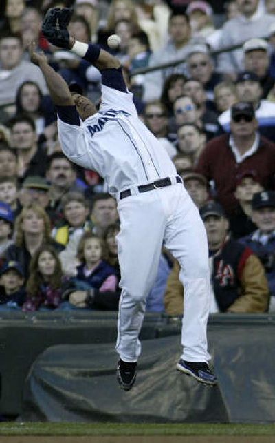 
Seattle Mariners second baseman Jose Lopez bobbles a foul ball. 
 (Associated Press / The Spokesman-Review)