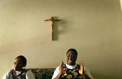 
Sister Esther Honugah, right, explains the pain of a mysterious illness. Sister Esther Honugah, right, explains the pain of a mysterious illness. 
 (Brian Plonka/Brian Plonka/ / The Spokesman-Review)