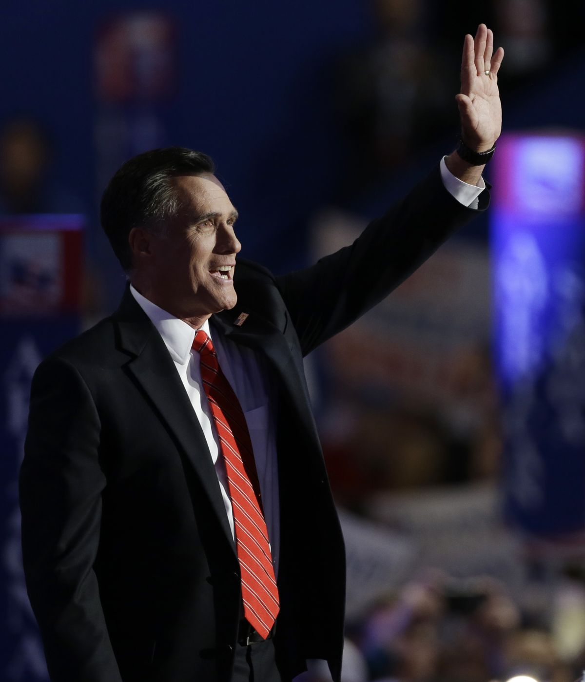 Republican presidential nominee Mitt Romney acknowledges cheering delegates during his address at the Republican National Convention in Tampa, Fla., on Thursday. (Associated Press)
