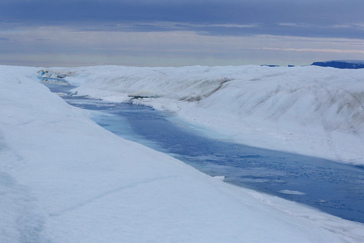 A 30-mile-long meltwater river runs through Greenland’s Petermann glacier in 2016.  (Whitney Shefte/The Washington Post)