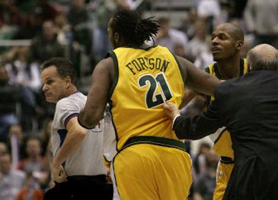 
SuperSonics coach Bob Weiss attempts to restrain forward Danny Fortson last Friday as he charges referee Mike Callahan after being called for a technical foul. 
 (Associated Press / The Spokesman-Review)