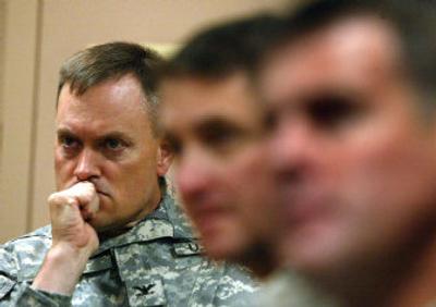 
Col. Robert Ball, left, listens Thursday as Col. Mike Shields of the 172nd Stryker Brigade Combat Team, not shown, announces the extension of the brigade's tour of duty in Iraq.
 (Associated Press / The Spokesman-Review)