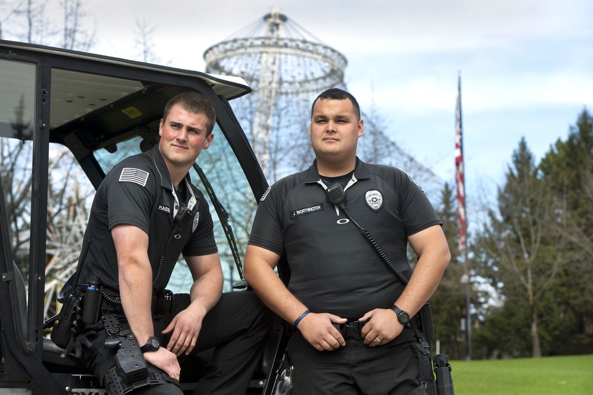 Spenser Rassier, left, and security supervisor Justin Worthington are part of Riverfront Park’s effort to reduce vandalism and increase safety. (Dan Pelle)