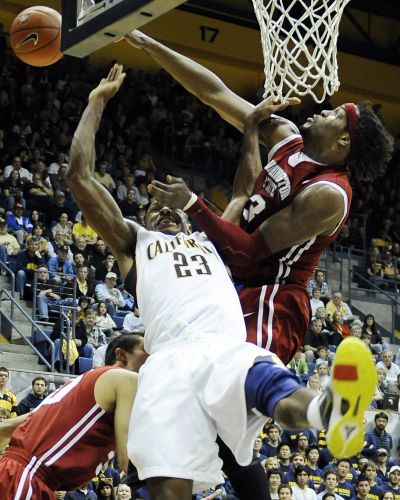 Californias' Patrick Christopher (23) is fouled hard under the basket by Washington State DeAngelo Casto, right, during second half action of their NCAA college basketball game in Berkeley, Calif., Saturday, Feb. 13, 2010. California won the game 86-70. (Thearon W. Henderson / Associated Press)