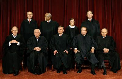 Justices of the Supreme Court sit for a group portrait in March  2006. Seated, from left, are Anthony M. Kennedy, John Paul Stevens, Chief Justice John G. Roberts Jr., Antonin Scalia and David Souter. Standing, from left, are Stephen Breyer, Clarence Thomas, Ruth Bader Ginsburg and Samuel Alito Jr.  (FILE Associated Press / The Spokesman-Review)