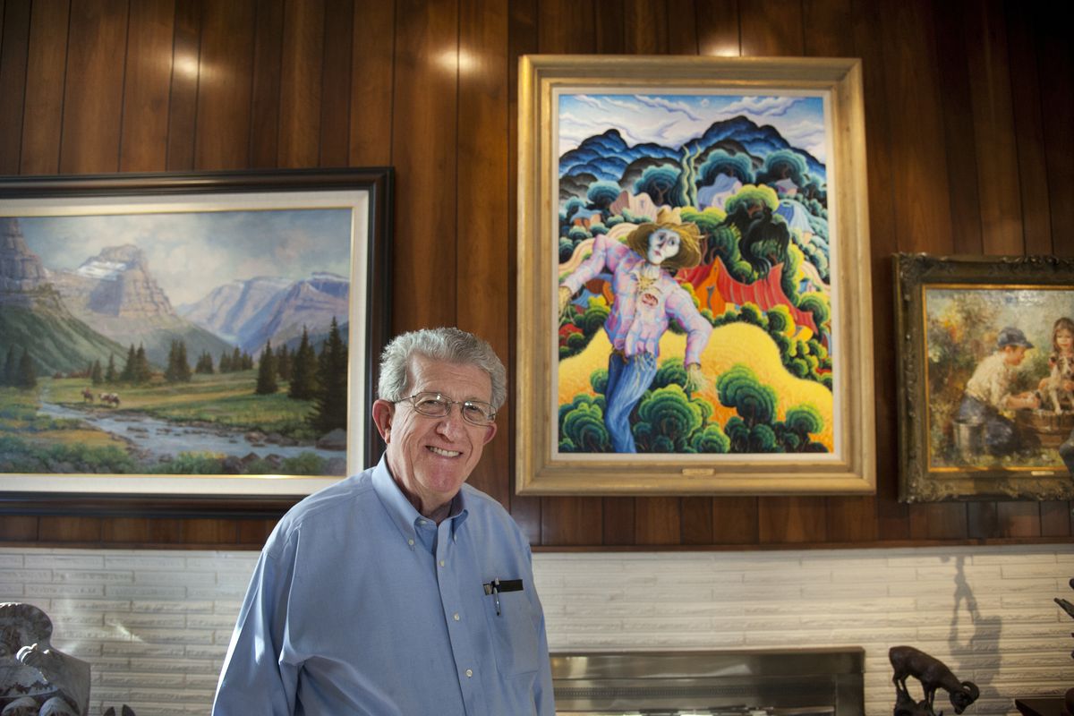 James Harken, of Spokane Valley, has an art collection that includes work from artists Mark Ogle, left, K. Douglas Wiggins, center, and Eva Makk. (Dan Pelle)