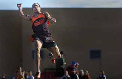 
Rashad Toussaint of West Valley soars through a jump in a meet at the school on March 30, when he won both the 100-meter dash and the jump events. 
 (Christopher Anderson/ / The Spokesman-Review)