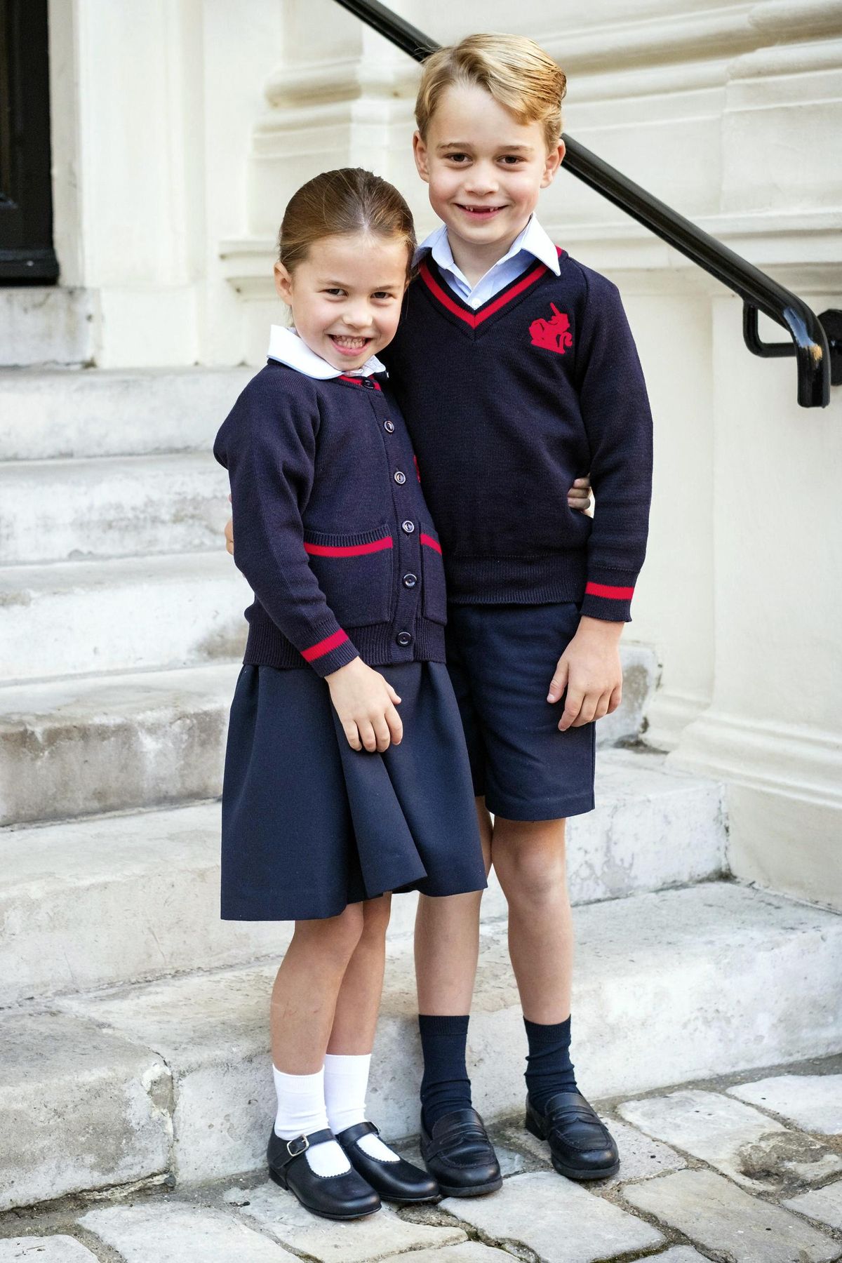 In this photo released by Kensington Palace, Britain’s Princess Charlotte poses with her brother Prince George before her first day of school at Thomas’s Battersea, in London, Thursday, Sept. 5, 2019. (Kensington Palace / Associated Press)