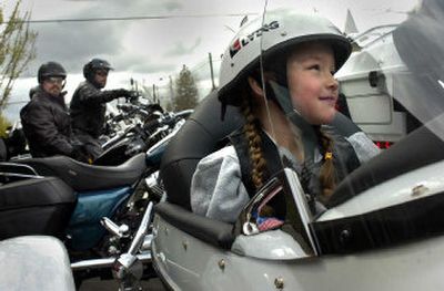 
MaryElizabeth Smith is all smiles on her 6th birthday. Smith has mitochondrial myopathy, a muscle degenerative disease, and was given a Harley-Davidson ride as part of her Wishing Star Foundation birthday gift. 
 (Jed Conklin / The Spokesman-Review)