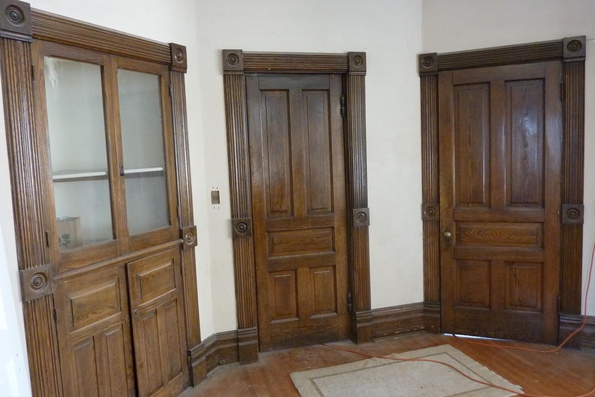 Two of the original ebony-finished oak doors in the dining room plus the original built-in china cabinet are seen in the James and Sarah Bayley House. (Photo by Stefanie Pettit)